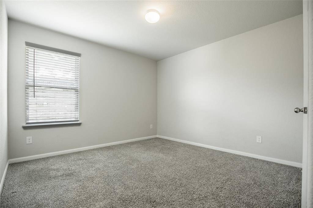 Bedroom 3, adjacent to the second full bathroom.
