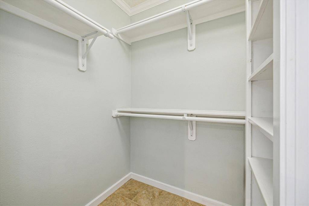 Ensuite bathroom closet [+ bonus closet with safe in primary bedroom].