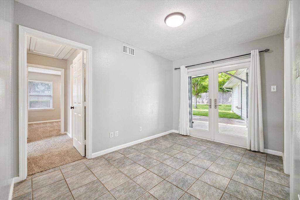Flex space located off of front living room can be used as perfect work from home space, exercise area, or any lifestyle use.