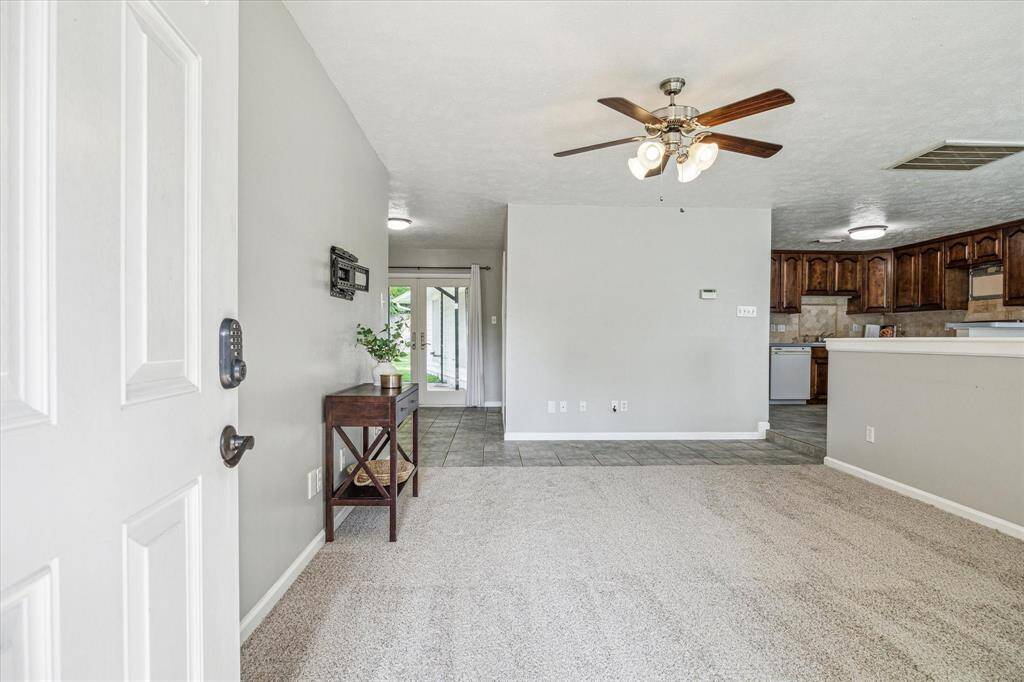 Immediately upon entering you are welcomed into the open-concept floor plan. *NEW CARPET*