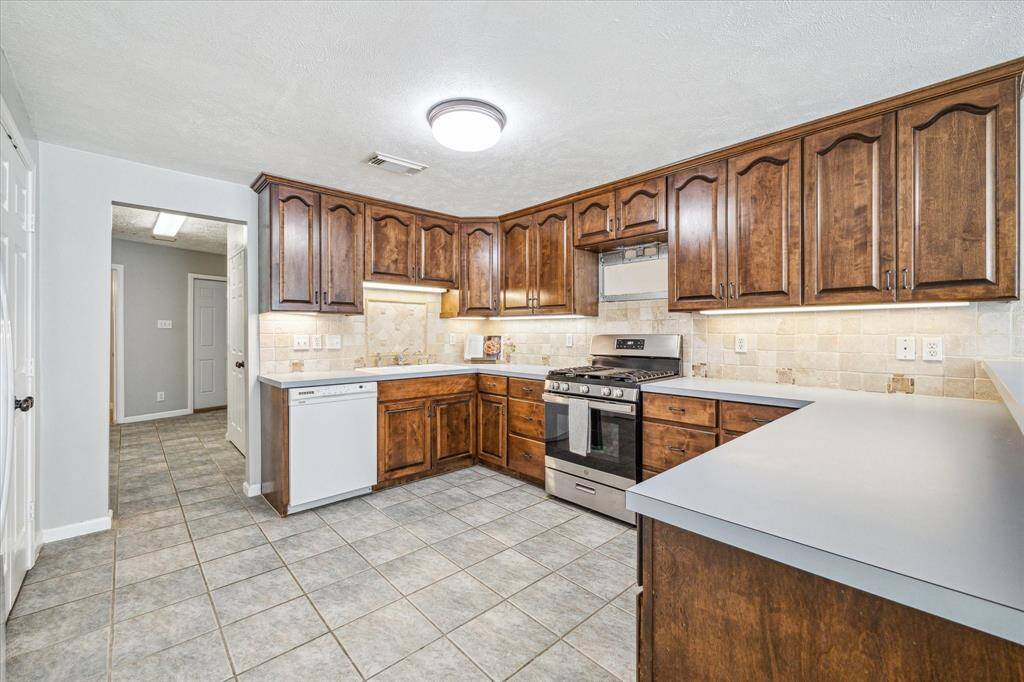 Spacious kitchen with LOTS of cabinet space and counter space.
