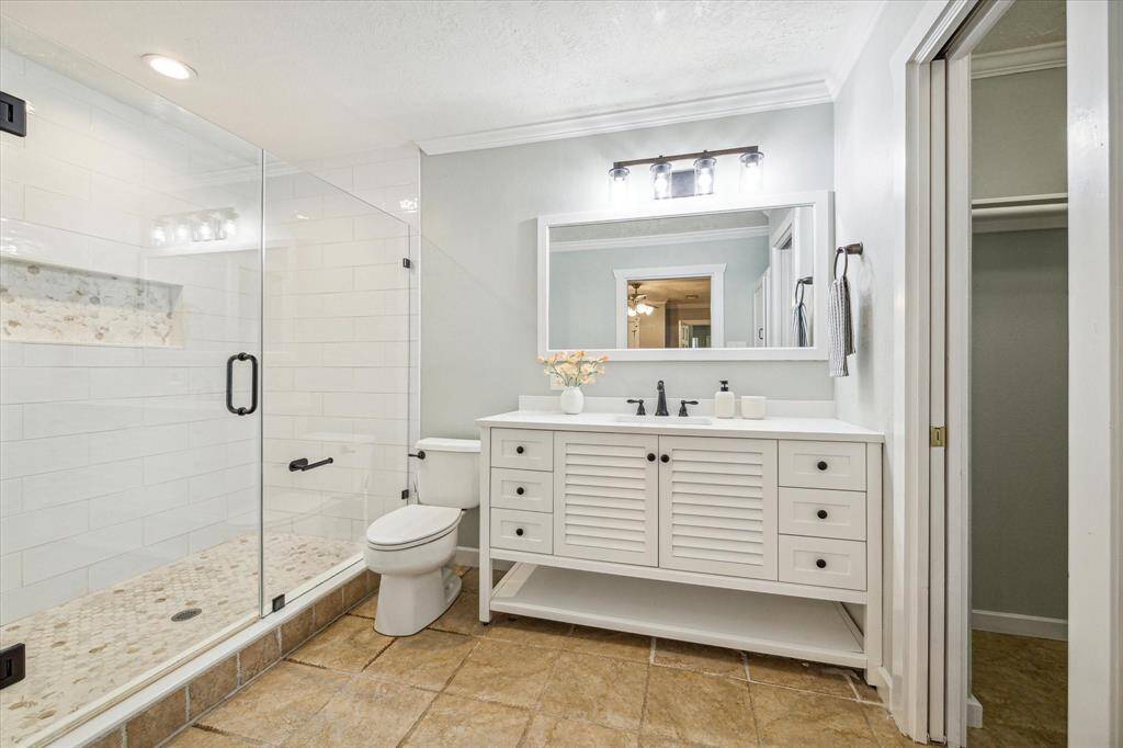 Updated ensuite bathroom with a generously sized stand-up shower.