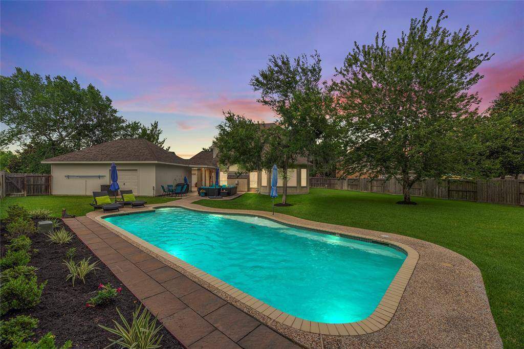 Fully fenced-in, the manicured backyard provides privacy and safety. Go for an evening swim or chat with friends over cupcakes and margaritas!