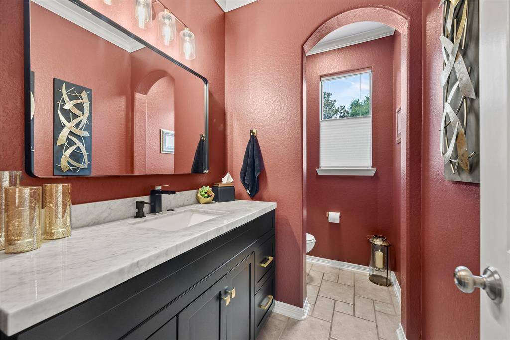 Hospitality is felt throughout the home and the powder room is no exception.