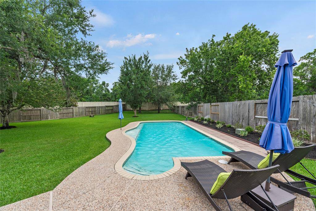 Whether you're hosting a pool party or enjoying a quiet swim, this backyard is designed for both fun and tranquility.