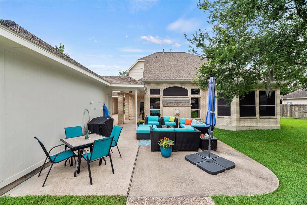 The wide patio has tons of space for al fresco dining. Chat with friends over cocktails, as the kiddos and dogs play in the fully fenced-in backyard.