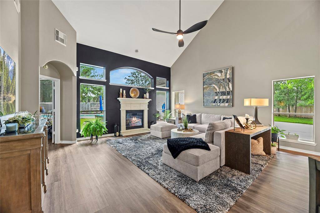 Welcoming and conveying warmth, the living room offers an inviting space for evening movies or holiday gatherings. Tune into your favorite streaming show, while admiring the cozy fireplace.