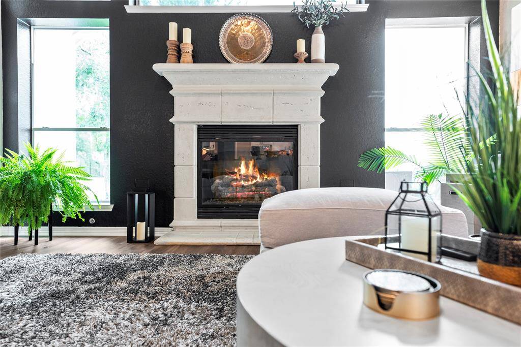Boasting a stately surround and mantle, the fireplace is the perfect place to display worldly treasures and favorite photos of family and friends. While you sit and read, you will always have a smile on your face when you look at your most valued relationships and experiences!