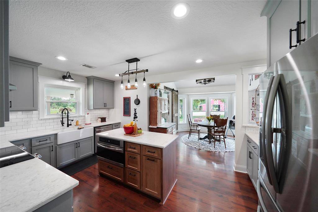 Enjoy effortless flow from the kitchen into the bright and charming breakfast nook, complete with views of the backyard and barn.