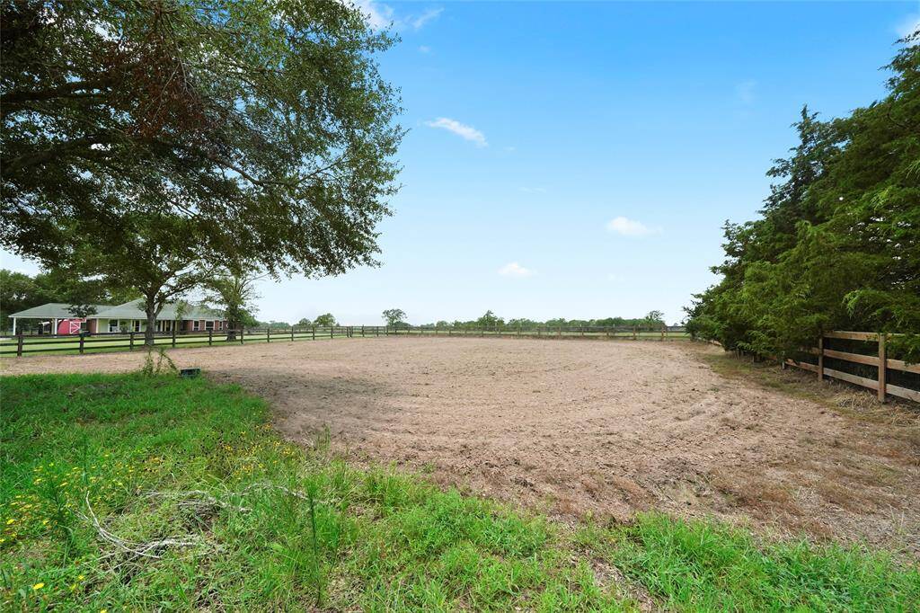 This spacious, fenced equestrian arena offers an ideal setting for personal, non-commercial equestrian activities. The open area is perfect for training, riding, or other horse-related exercises. Enjoy the peace and privacy of this dedicated space.