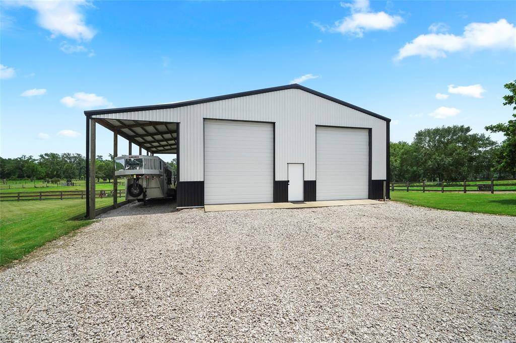 This versatile metal shop features large double doors for easy access, ideal for vehicle storage, machinery, or workshop use. Plenty of room for personal or commercial use.