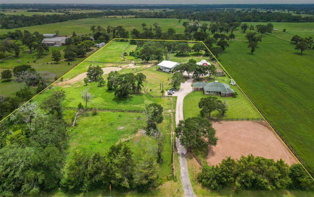 This aerial view with property boundaries outlined clearly displays the full extent of the land. The marked boundaries provide a great visual of the spacious property, ideal for equestrian activities, farming, or further development.