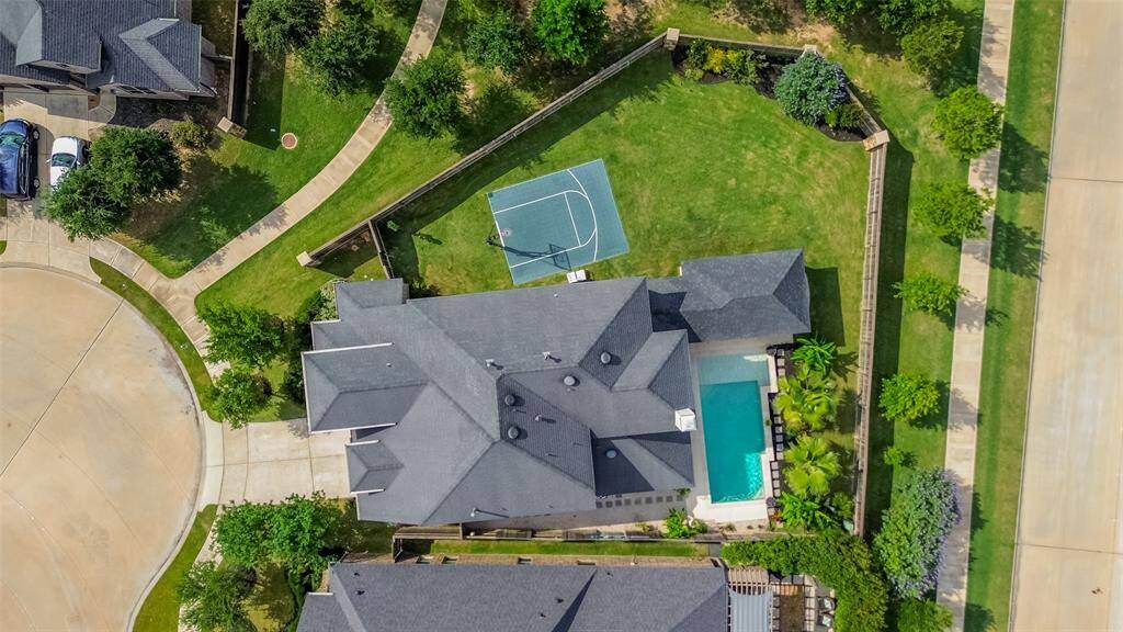 You’ll be wowed by this incredible home, perfectly situated on a quiet cul-de-sac and boasting an oversized lot with everything you’ve been dreaming of! Enjoy your own private oasis featuring a sparkling pool, an outdoor kitchen, a spacious covered patio, and even a basketball court—with plenty of green space left over for play or relaxation. This one truly has it all!