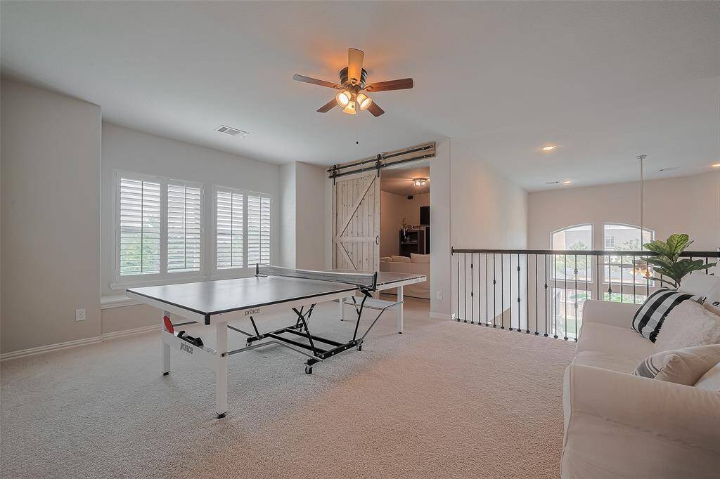 Upstairs offers a versatile space that can serve as a second living area or a fun-filled game room—whatever best fits your lifestyle