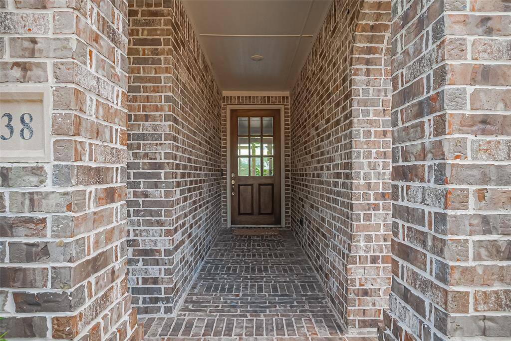 Step through the front door into a beautifully designed home featuring rich wood floors throughout the main level, a stunning white kitchen that seamlessly opens to the family room and dining area, and a breathtaking view of your private backyard oasis