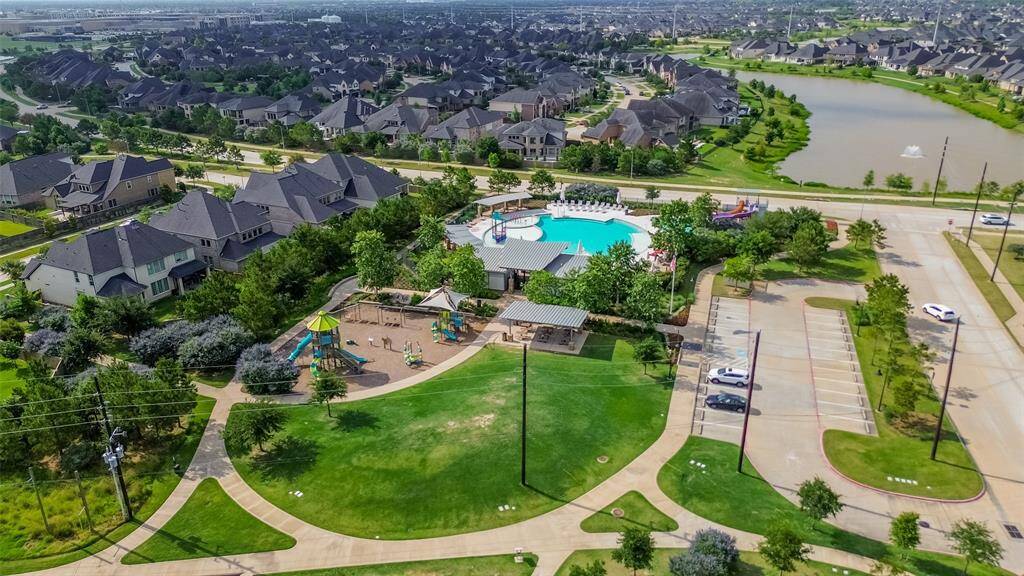 Greenthread Park with plenty of green space, playground, pool - how convenient for the children in your life!
