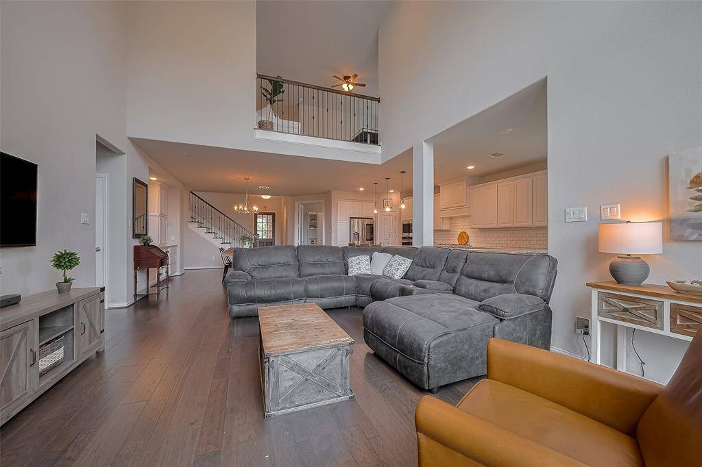 The family room maintains a warm and cozy ambiance—perfect for relaxing