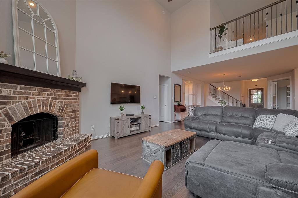 The gas-burning fireplace beautifully enhances that cozy vibe, adding warmth and charm to the spacious family room