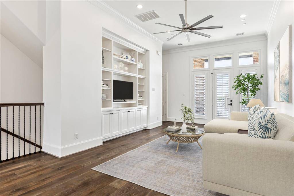 This perfect lounging and entertaining space is the heart of the home, with upgraded stainless steel oversized fan in living space with remote and pre-wired for surround sound.