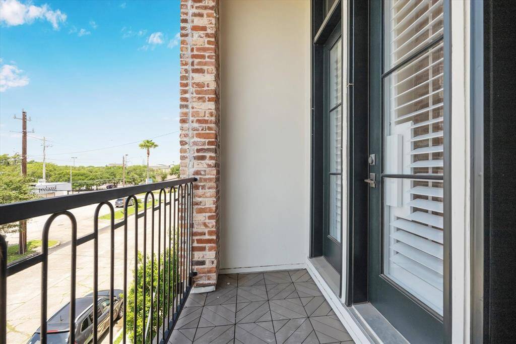 Lovely patio adjacent to living room with patio tile is perfect for a morning coffee. A pull down solar screen to protect from sun, allowing comfort on the patio and cooling the home during the summer months