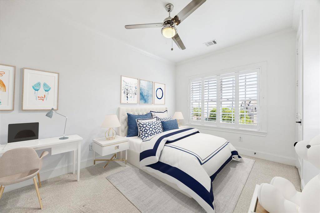Secondary bedroom on the 4th floor with beautiful views of the Texas Medical Center and ensuite bath.