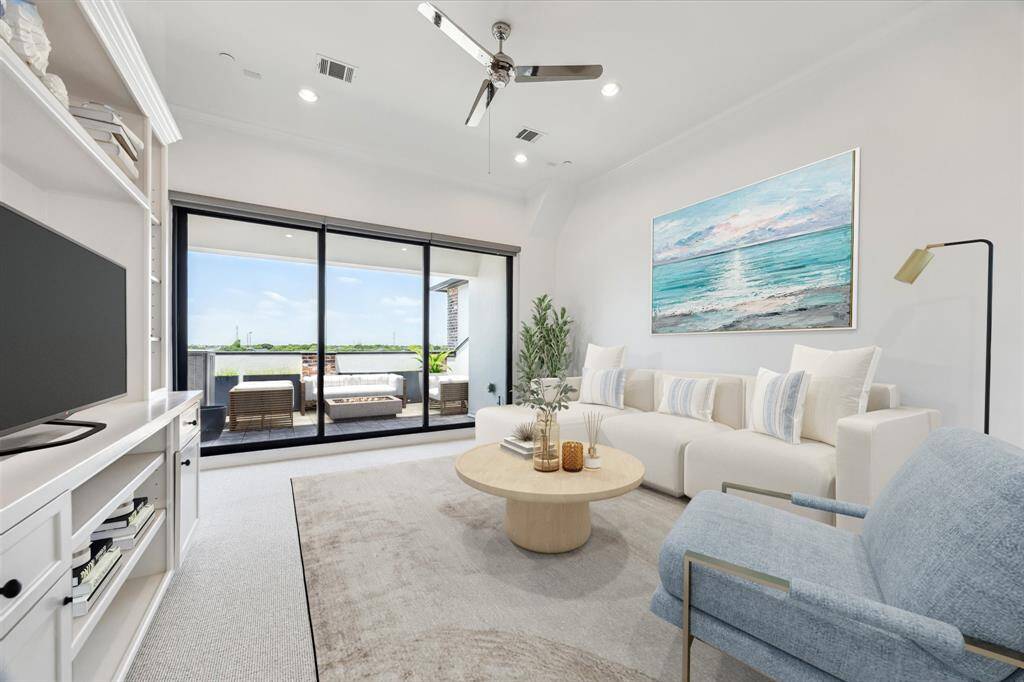 A hangout oasis on the 4th floor with 12 ft ceilings and all the space for whatever your heart desires, whether it's lounging, watching movies, playing games or just relaxing with beautiful views. This stellar game room is pre-wired for sound and features indoor/outdoor living with stacking sliding three panel glass door and three panel solar window roll down shades.