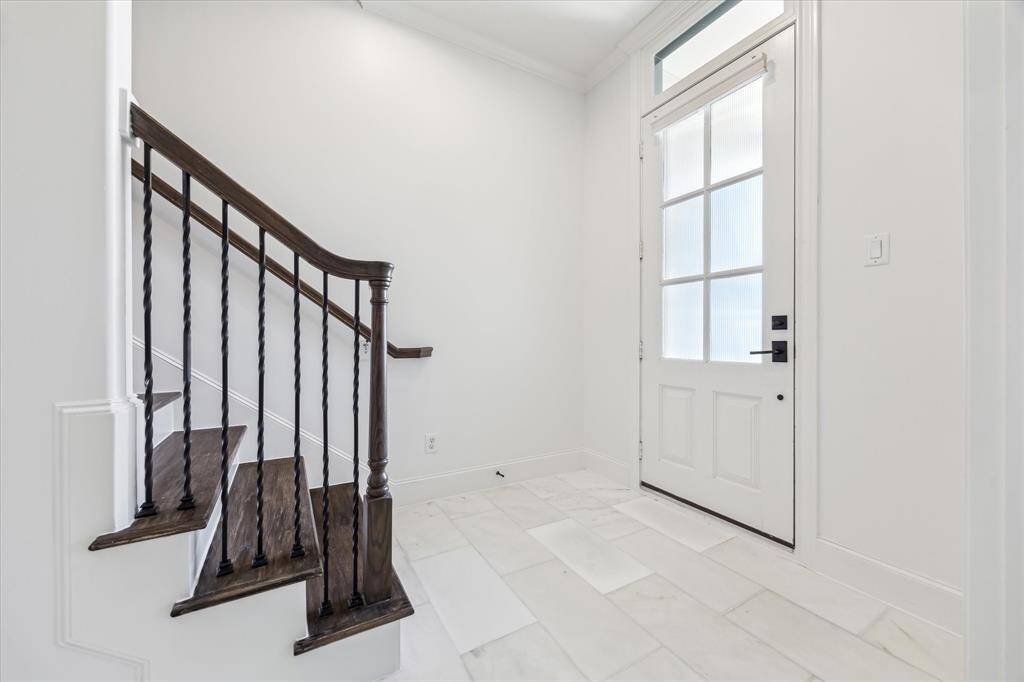 Spacious front entry with beautiful and durable marble tile.