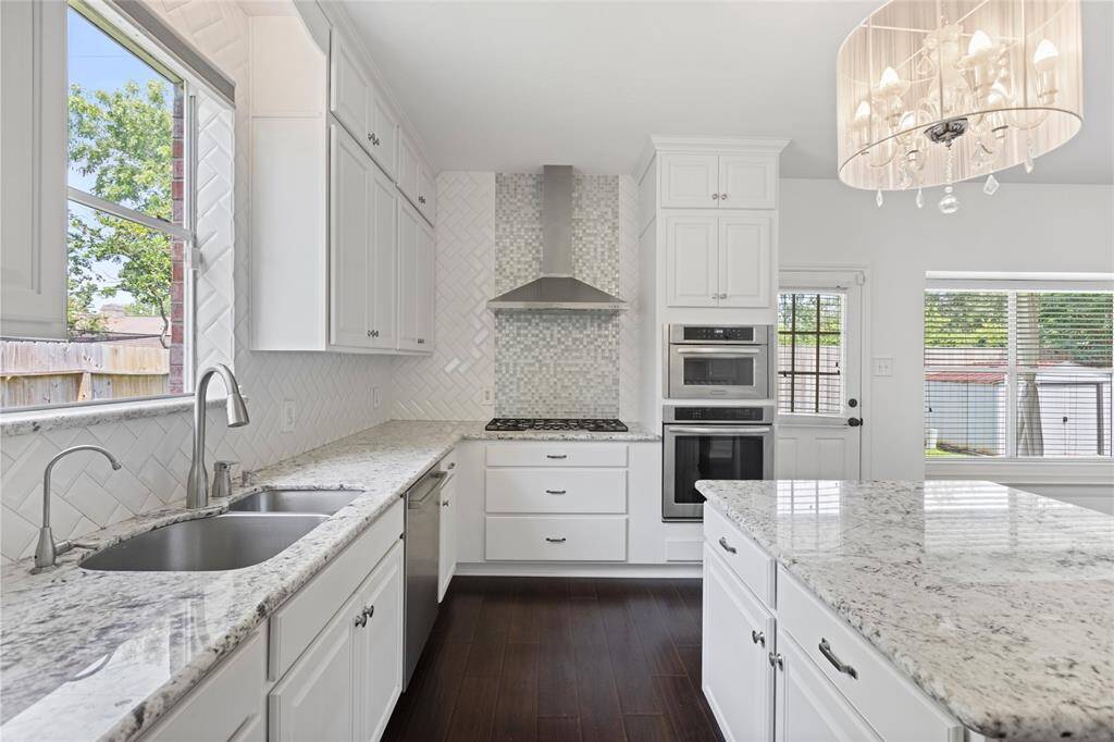 Gas range and the amazing picture window over the sink are some things that stand out!