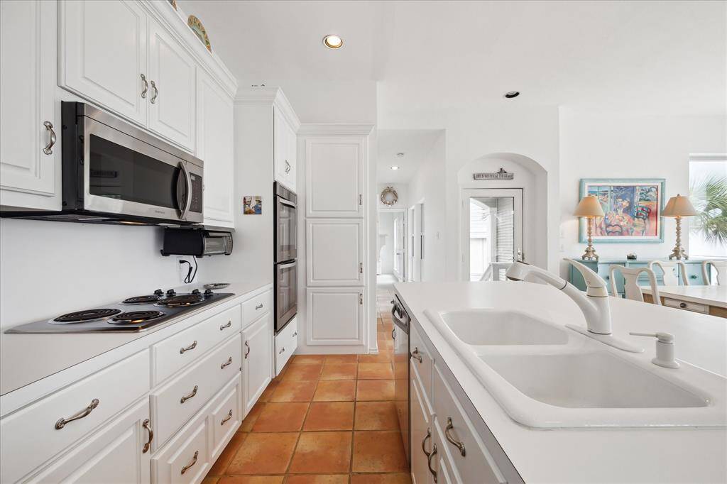 Another view of the kitchen, loads of cabinet storage space for all your kitchen essentials.