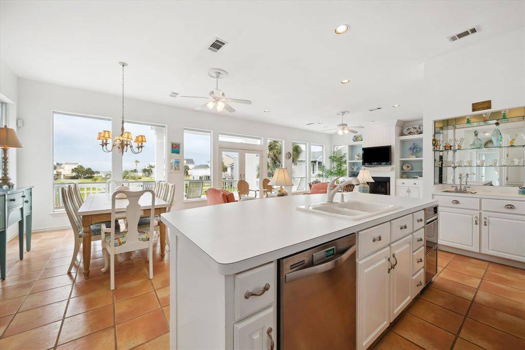 Another of the Kitchen towards the Great Room with dining area and wetbar steps away from the kitchen for easy access.  A great space for entertaining.