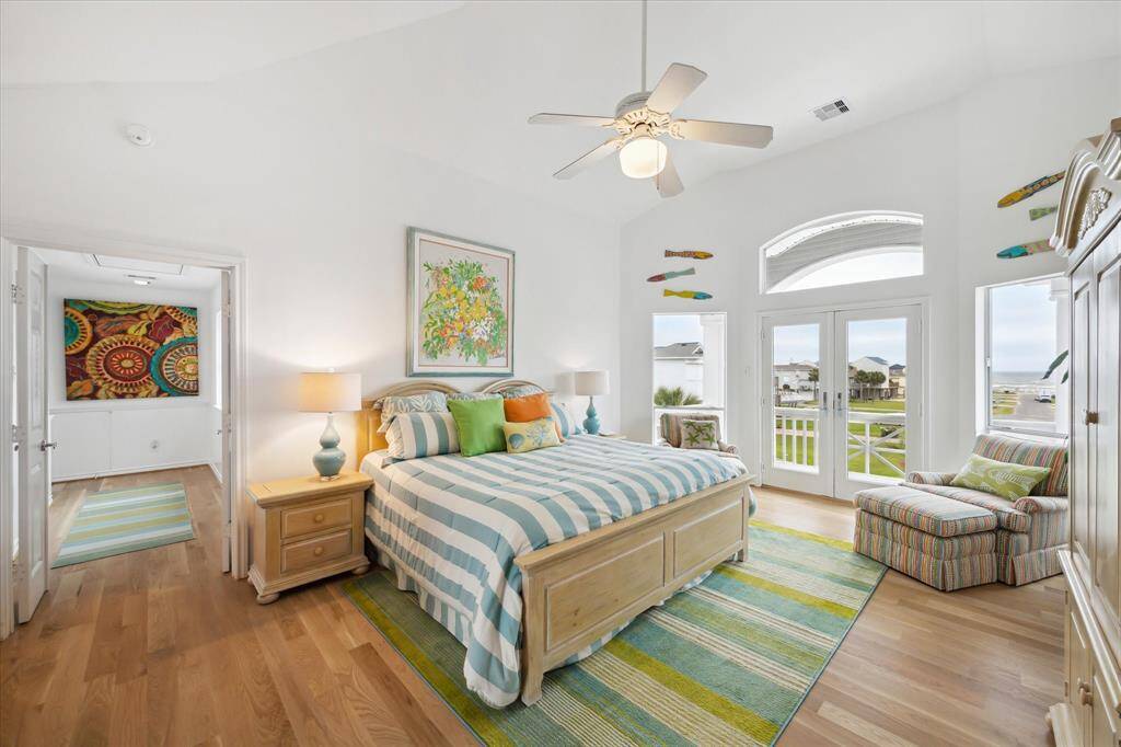 Secondary bedroom on West side - Main Floor -   High ceilings, fans and carpet make the room so airy and comfortable.