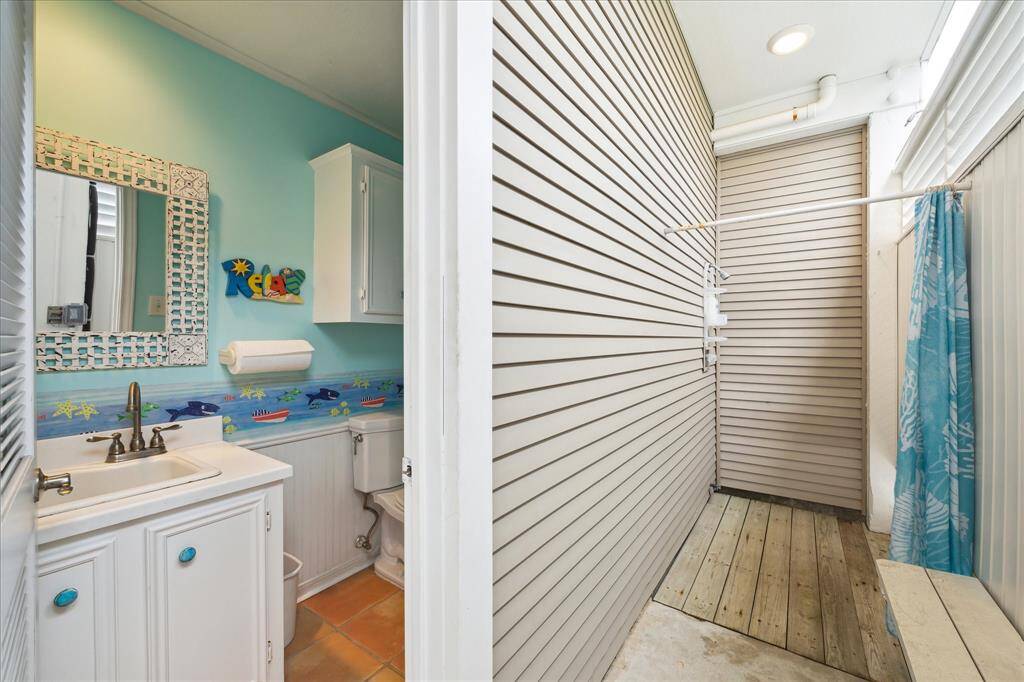 Enclosed private shower and half bathroom on Ground Level.  Easy access right off from time on the beach.