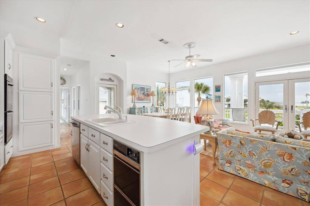 Another view of the Kitchen towards the Great Room. Notice the built in icemaker at the end of the island.  You can do the dishes while enjoying a magnificent view!