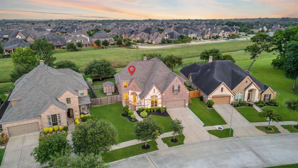 Stunning 5-Bed Highland Home in Riverstone – No Backyard Neighbors! This beautifully designed home offers 5 beds, 5.5 baths & full home generator!