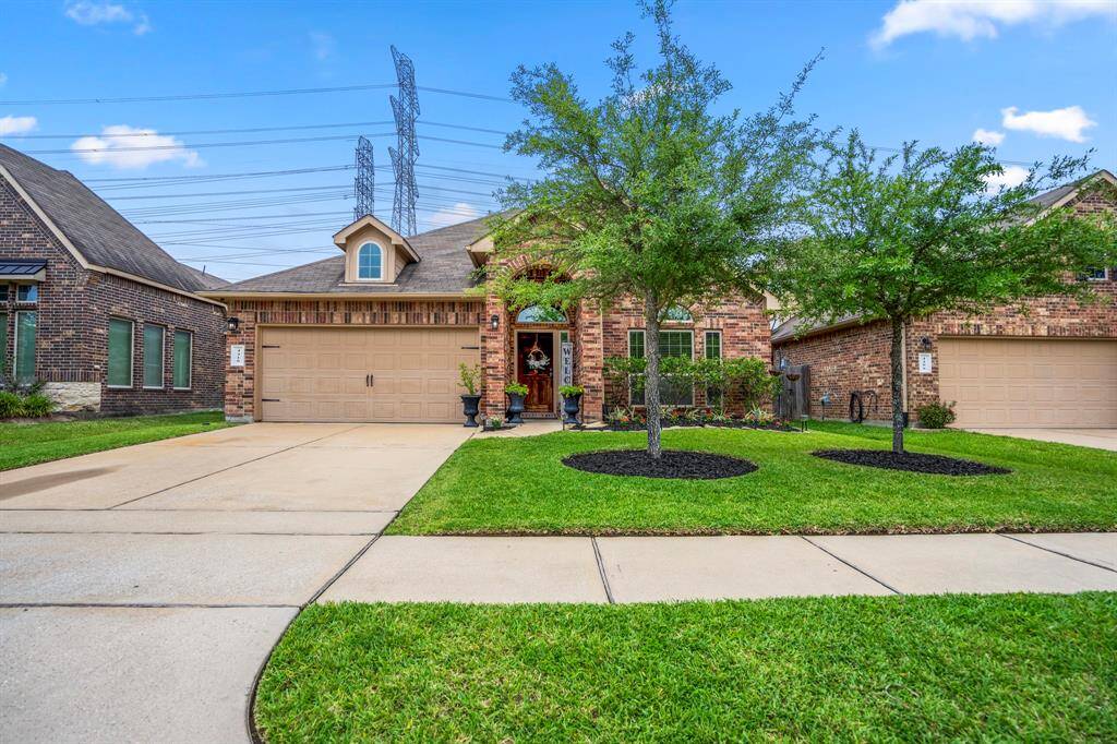 Welcome to 4410 Fenway Park Way, nestled on a quiet street with no rear neighbors. The well-kept yard and spacious 2-car garage set the stage for comfortable living right from the front door.