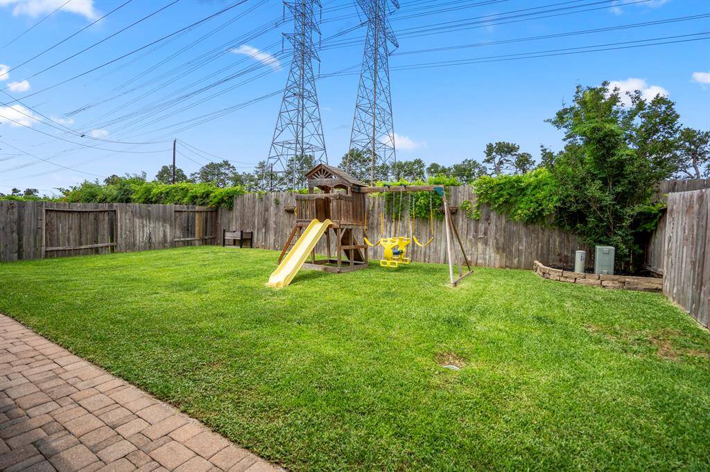 Gazing out into the backyard, enjoy the peaceful privacy of no rear neighbors—your own quiet retreat framed by a lush, open lawn.
