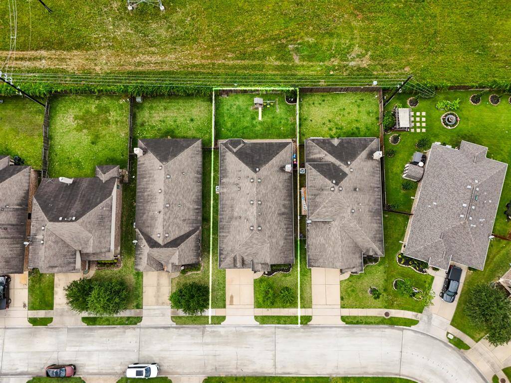 A crisp bird’s-eye view looking straight down showcases the home’s footprint, the spacious yard, and the thoughtful layout that makes this property feel both open and inviting from every angle.