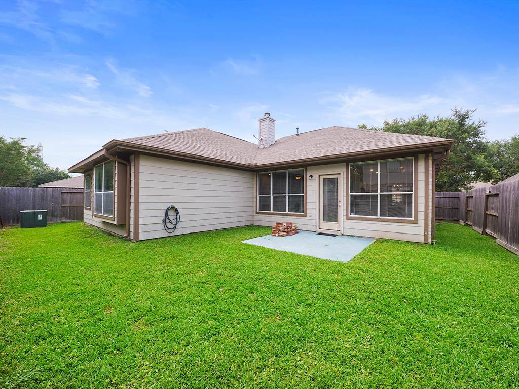 Enjoy outdoor living in the large backyard with a patio, perfect for entertaining or relaxing.
