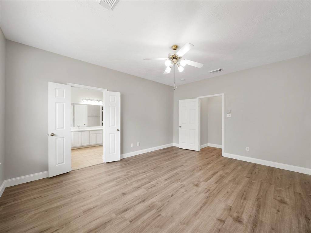 Primary bedroom has ample space for larger furniture.