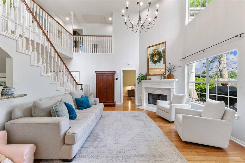 A look into the family room before heading upstairs.  The showcase feature of this home is the union of indoors and outdoors throughout.  A wall of windows floods the home with natural light, enhancing the warm and open atmosphere.