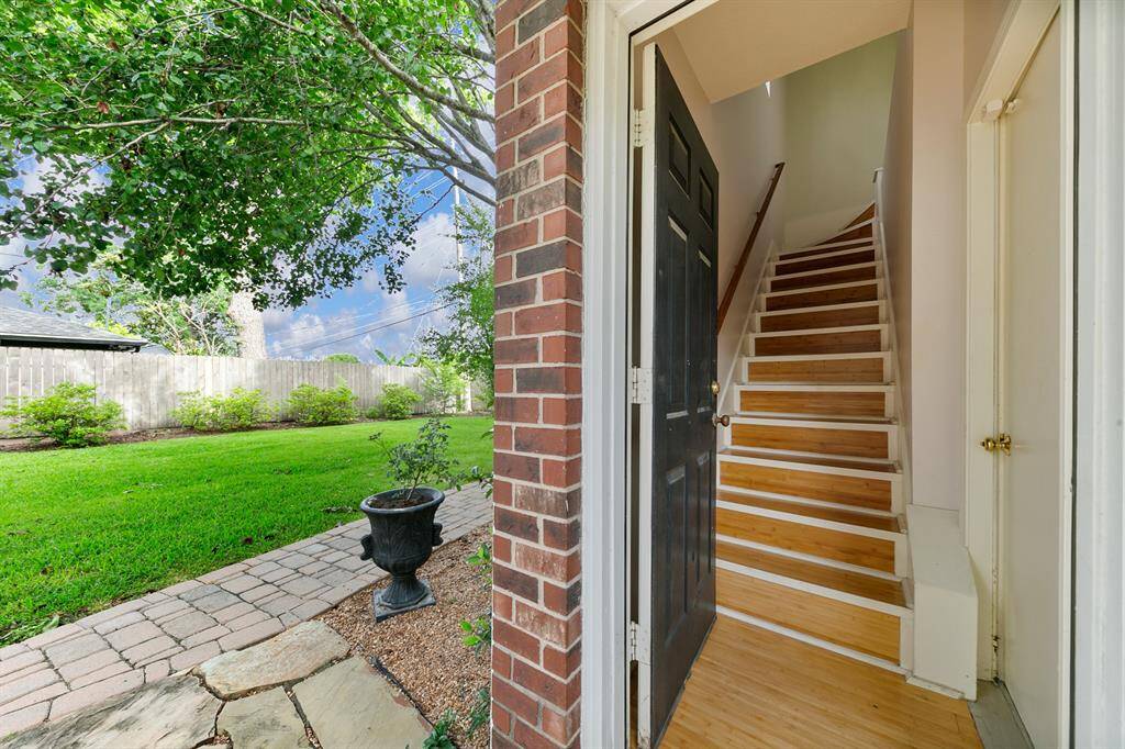 A private entrance off the covered, flagstone walkway leads to a spacious garage apartment with beautiful engineered bamboo flooring leading the way.  A perfect space for a home office, workshop or long-term guests, this apartment is a huge bonus for any family.