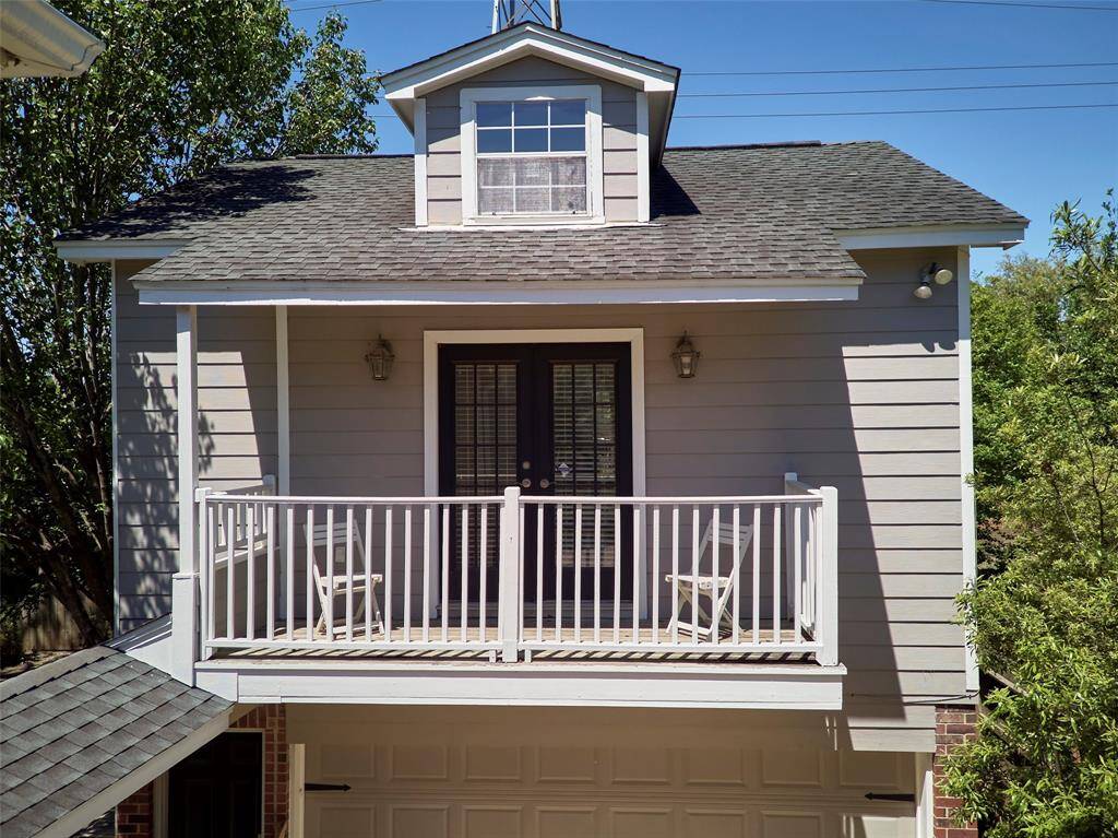 The cozy balcony off the studio apartment above the garage is the perfect spot to enjoy your morning coffee or unwind in the evening.