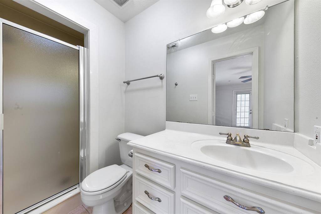 The full studio bath offers stylish cultured marble counters and undermount sink, plus a walk-in shower.