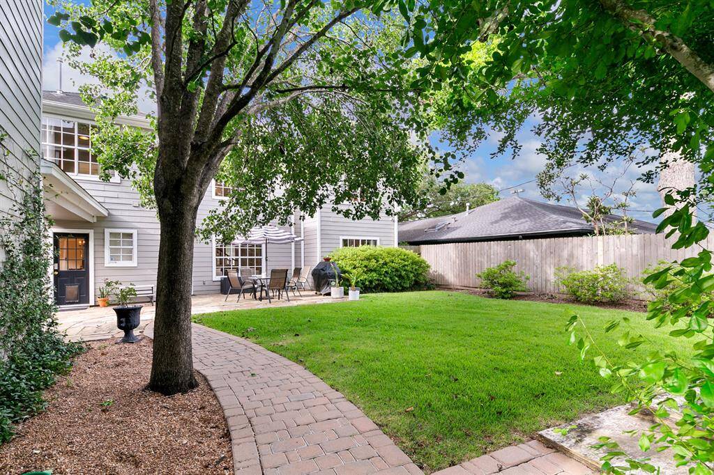 One last look at the beautiful, enormous backyard—just imagine the memorable gatherings you could host with family and friends!