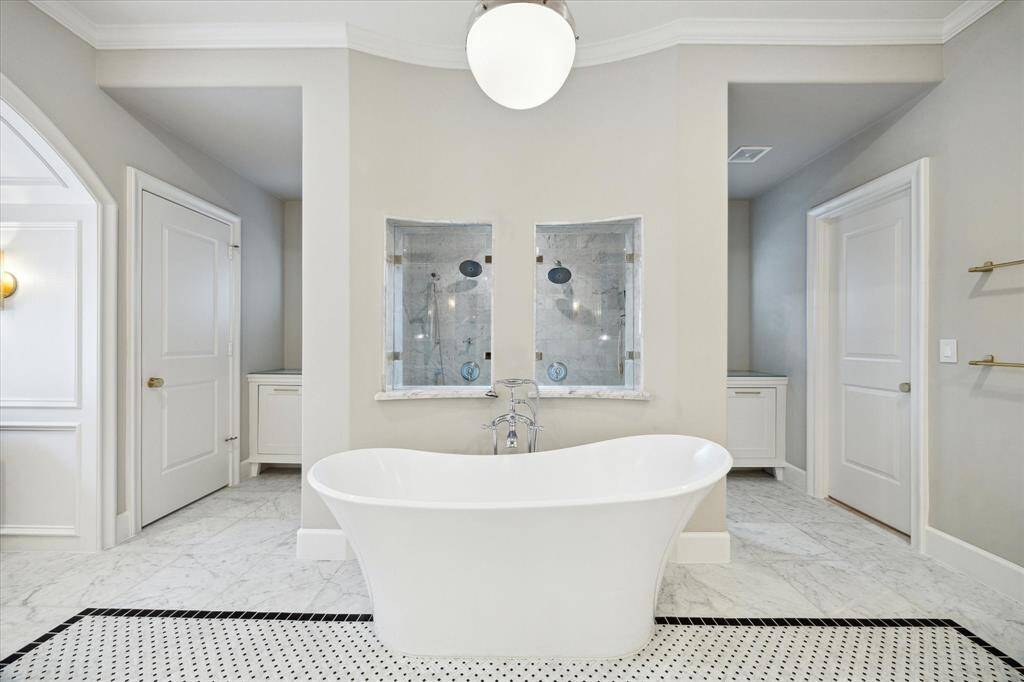Spa like primary bathroom with free standing soaking tub.