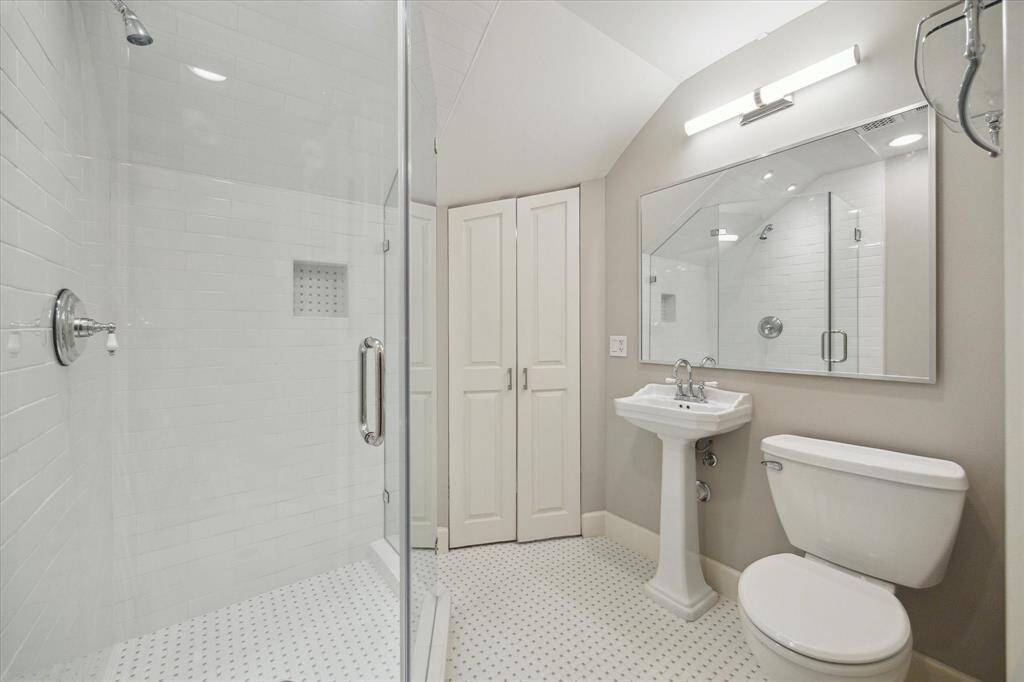 En-suite bath with shower and walk-in closet on third floor.
