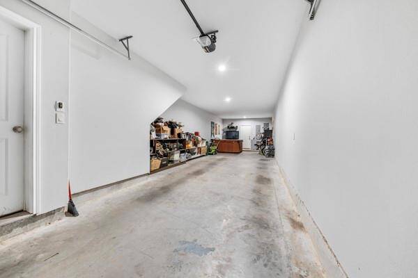 Oversized 2-car garage, with a unique bonus of a jacuzzi. Great for relaxing after a long day or entertainment.