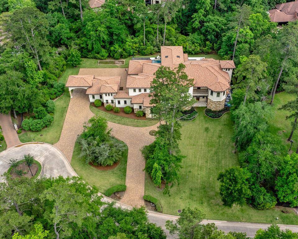 Over an acre of gorgeous mature trees wrap and create the perfect backdrop for this stunning Jeff Paul Custom Home.