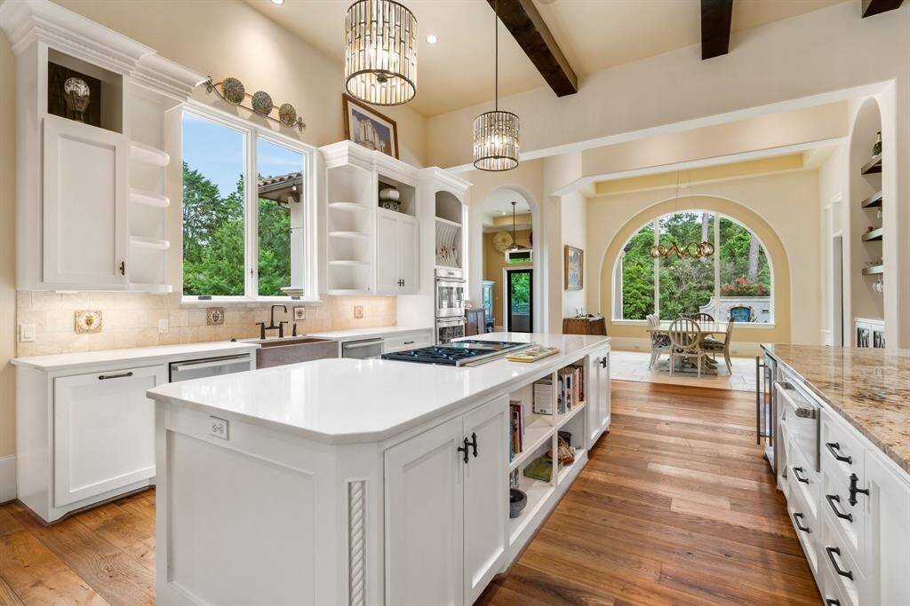 The kitchen provides every comfort and is open to the all the first floor living areas making entertaining a breeze. Surrounded by expansive windows the home enjoys plenty of natural light throughout.