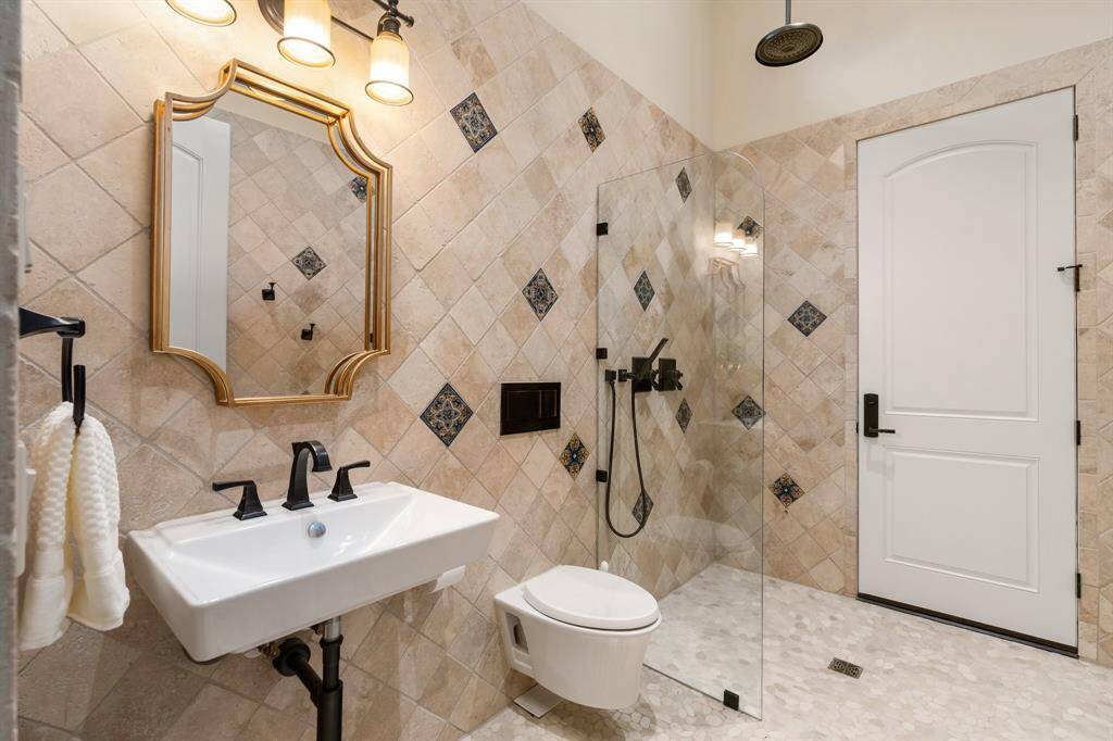 Game room full bath also doubles as a convenient pool bath.